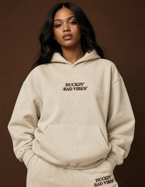 DUCKIN BAD VIBES CENTER LOGO EMBROIDERED HOODIE ￼(CREAM)