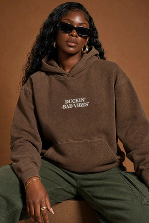 DUCKIN BAD VIBES CENTER LOGO   EMBROIDERED PREMIUM HOODIE (BROWN)