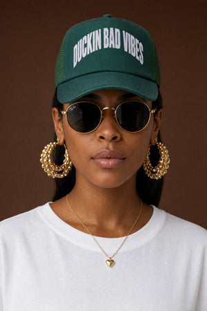 DUCKIN BAD VIBES ARCH TRUCKER HAT